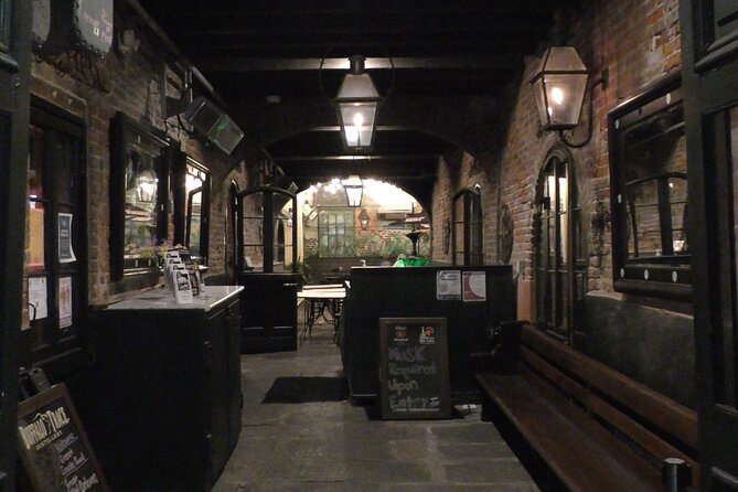 New Orleans Lewd Spirits Haunted Tour with Bar Stops - Walking through the French Quarter’s darker stories